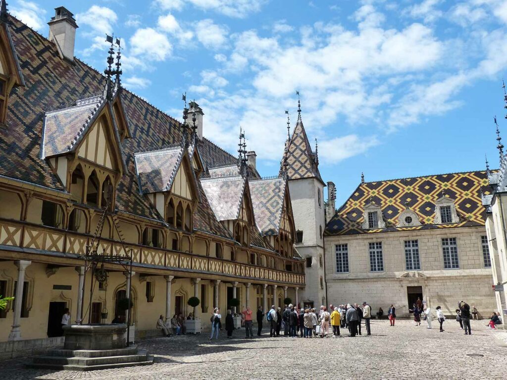 tiled roofs and 13th century buildings tour in France.