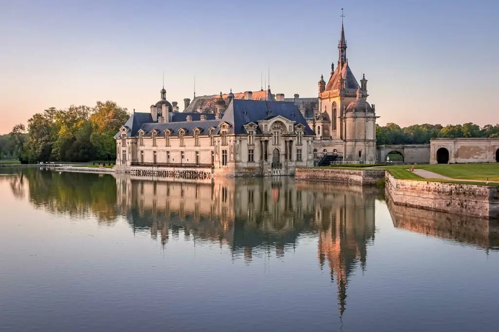 Tour guide and guests at Chantily Castle in France
