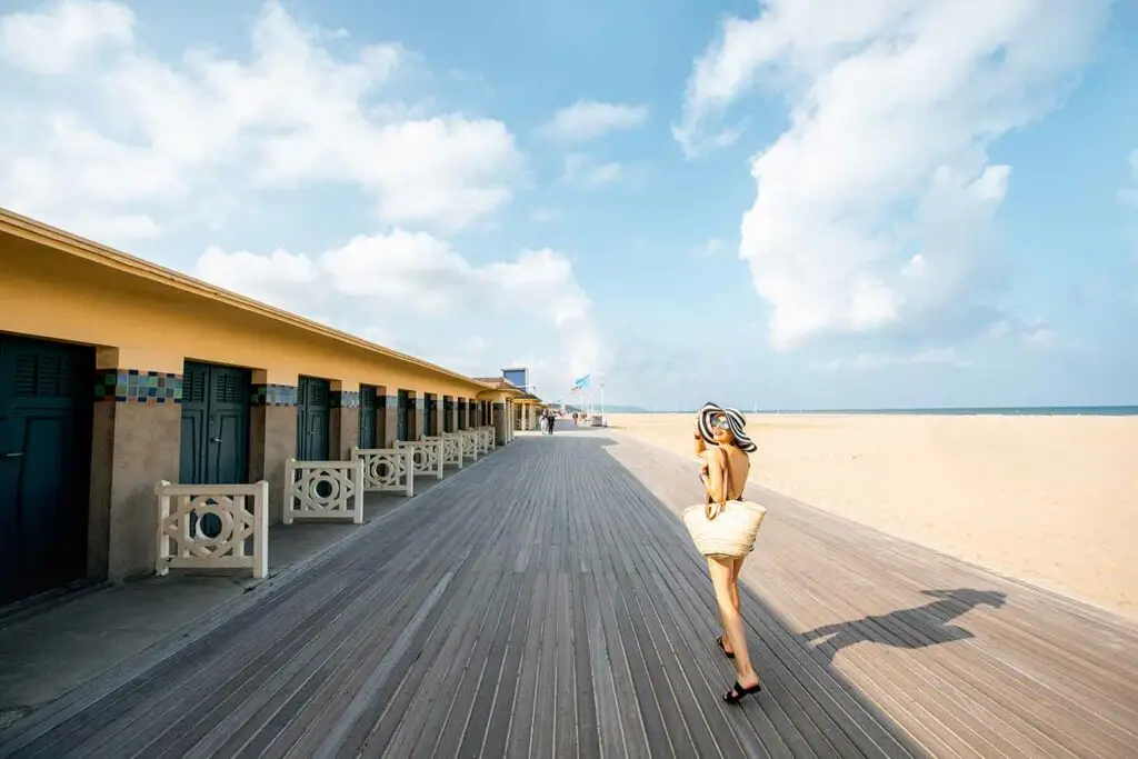 Woman enjoying the sun on Deauville beach.