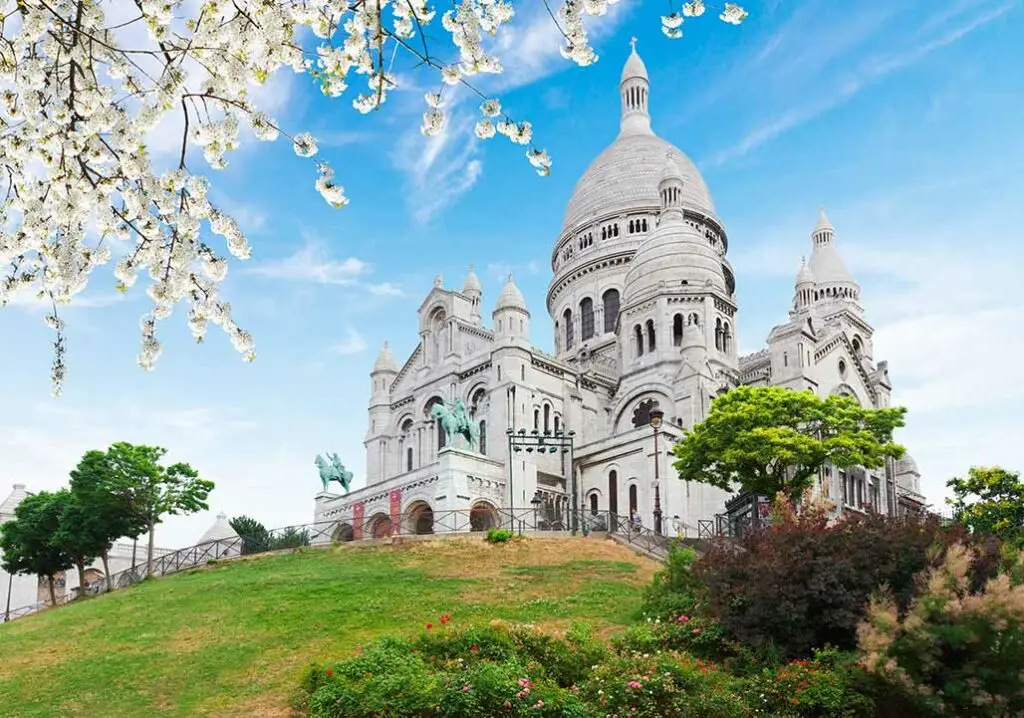 Guide showing guests the Sacre Coeur, known as Sacred Heart of Montmartre church.