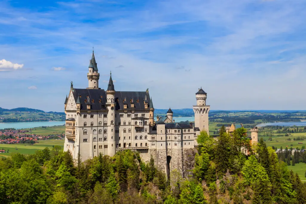Neuschwanstein Castle in the Bavarian Alps, Germany, a picturesque fairytale castle surrounded by lush forests and panoramic views of the countryside.