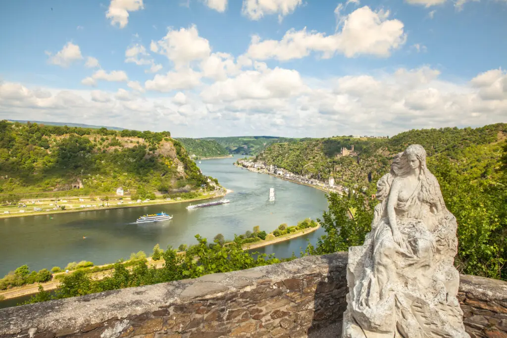 Loreley statue overlooking the scenic Rhine Valley and Sankt Goarshausen from Lore Ley rock, a popular tourist destination in Germany
